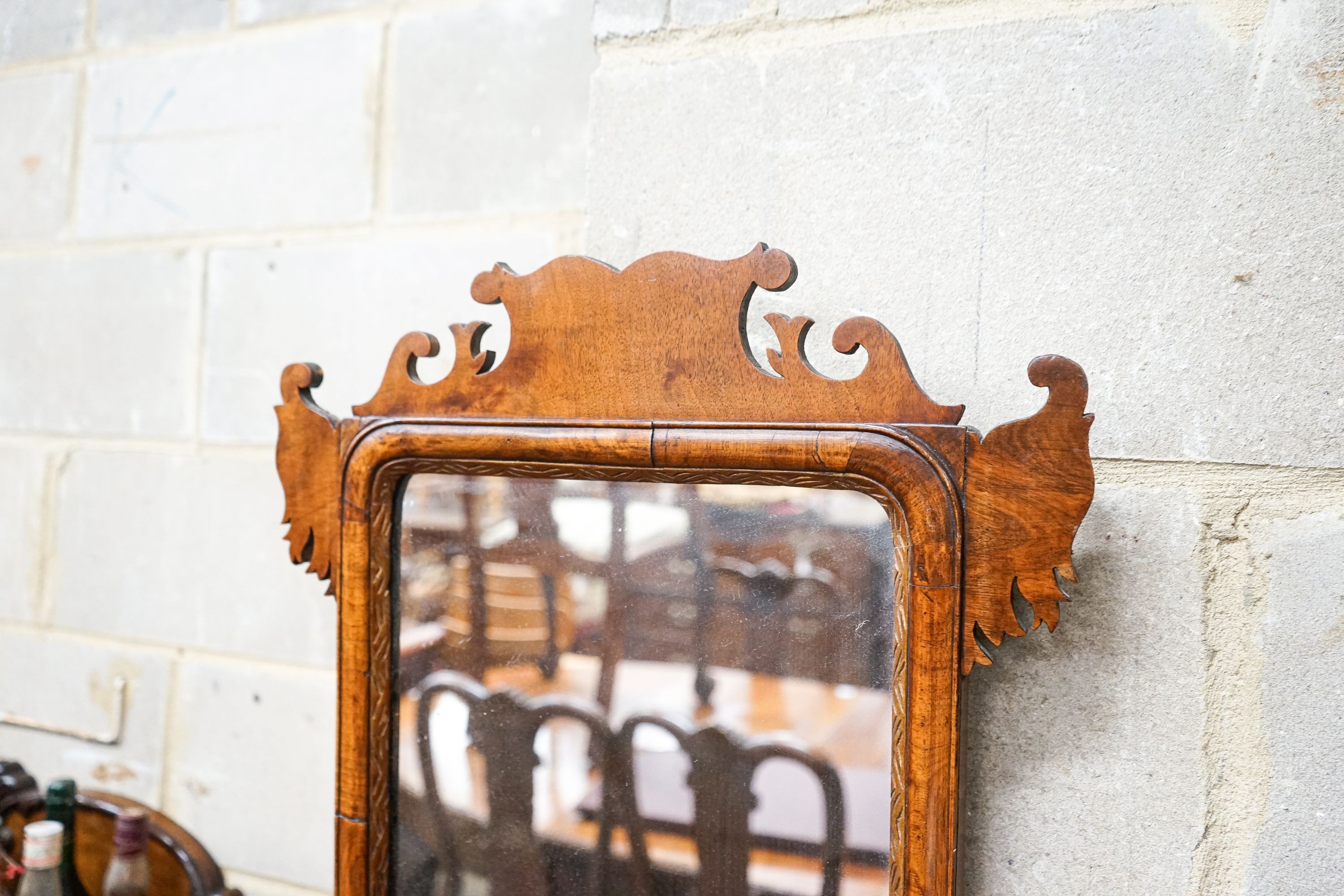 A George III style walnut fret cut wall mirror, width 47cm, height 66cm